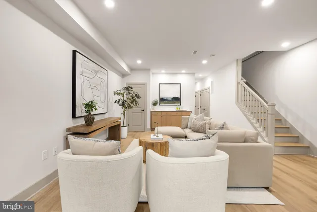 a bedroom with a bed and a night stand