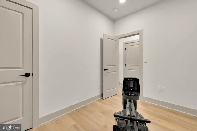 a view of a house with wooden deck and furniture