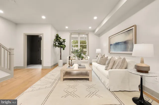 a living room with furniture and a table
