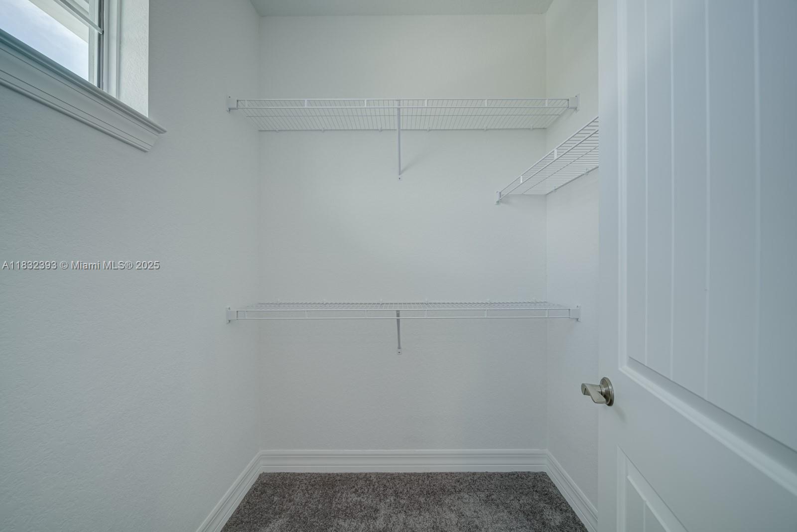 1280 Eucalyptus Drive, Unit 4 Hollywood, FL 33021 - Photo 12 of 36 a view of a room with racks on the wall