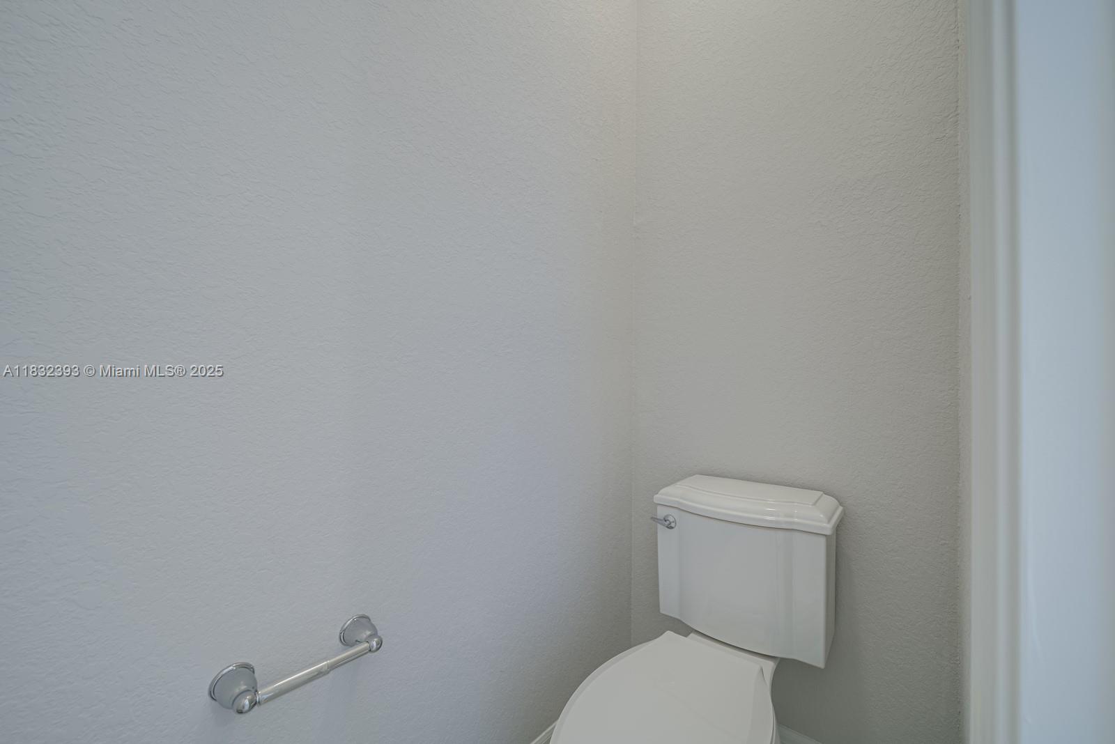 1280 Eucalyptus Drive, Unit 4 Hollywood, FL 33021 - Photo 14 of 36 a white toilet sitting next to a white wall