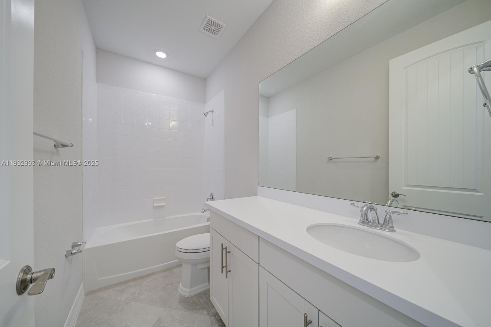 1280 Eucalyptus Drive, Unit 4 Hollywood, FL 33021 - Photo 15 of 36 a bathroom with a sink a toilet and shower