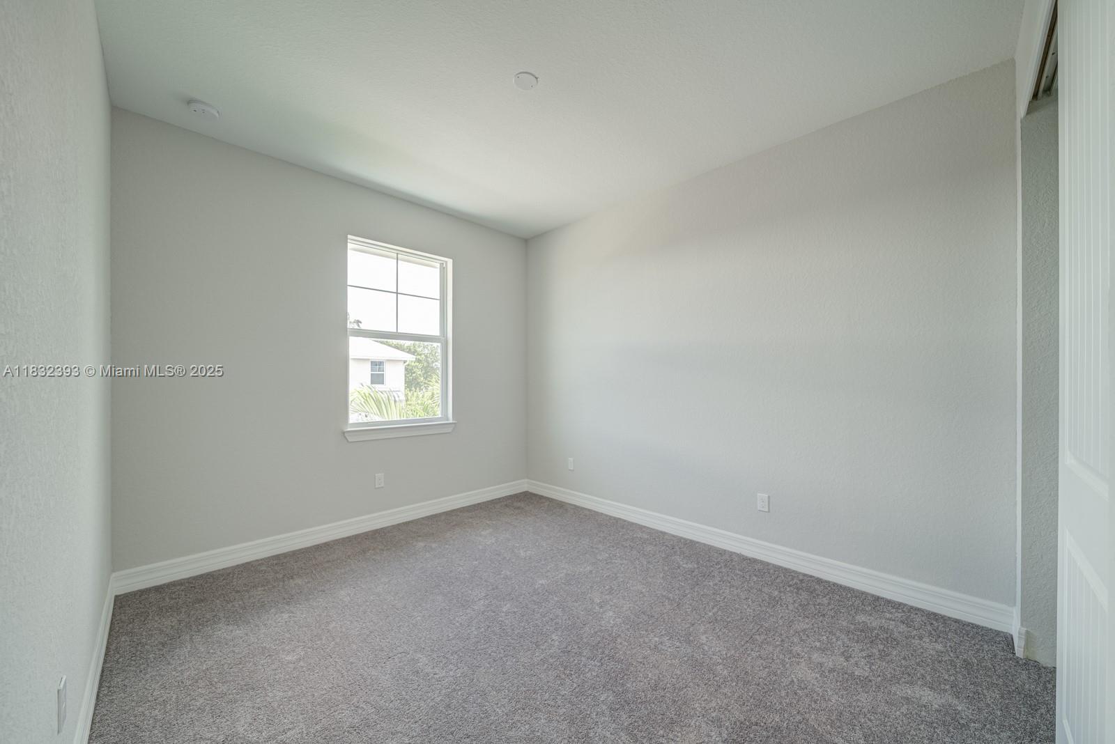 1280 Eucalyptus Drive, Unit 4 Hollywood, FL 33021 - Photo 16 of 36 an empty room with a window