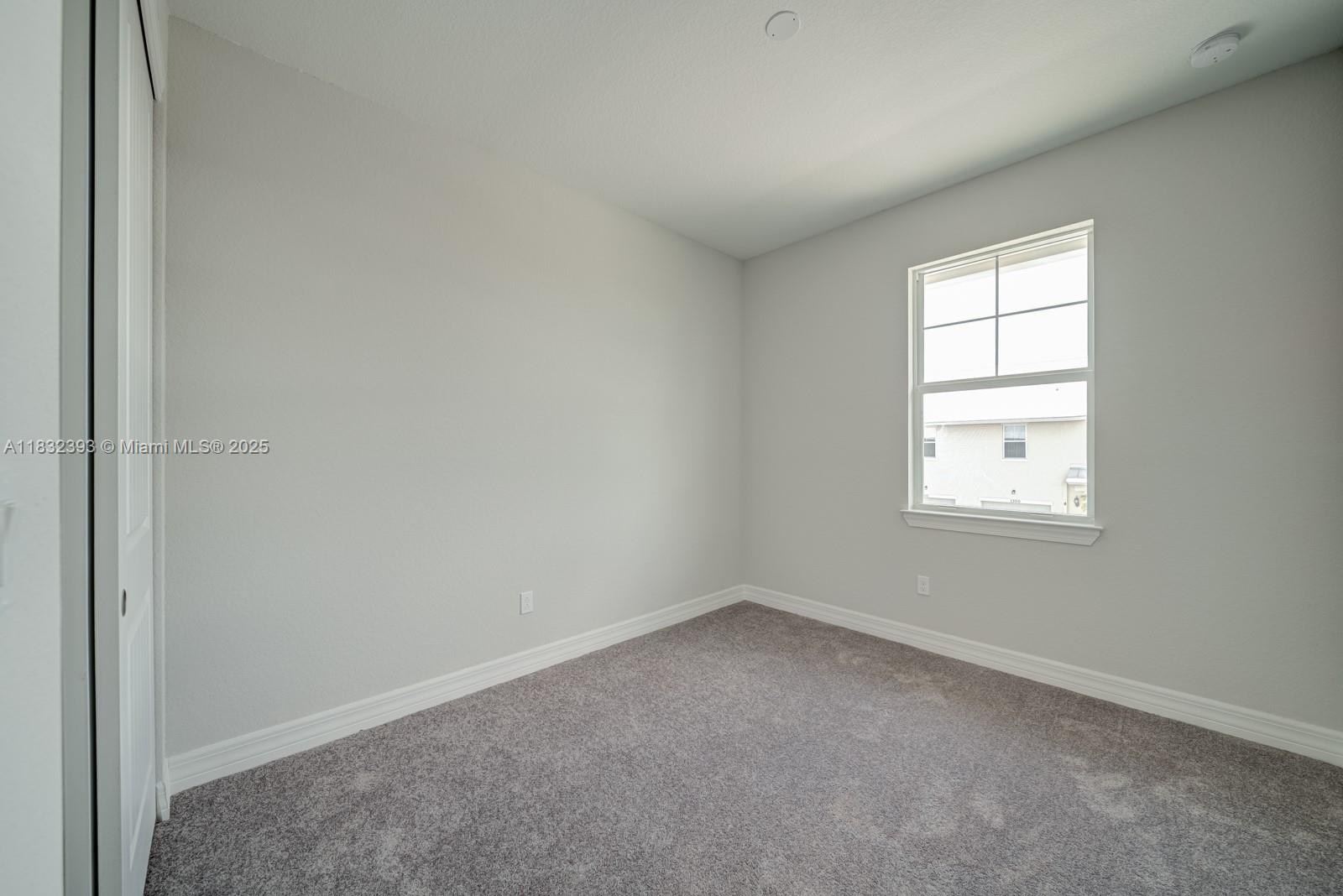 1280 Eucalyptus Drive, Unit 4 Hollywood, FL 33021 - Photo 17 of 36 an empty room with a window