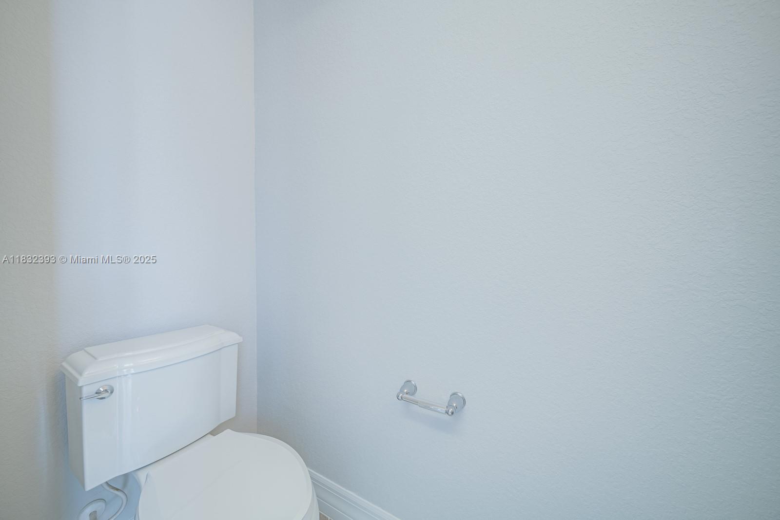 1280 Eucalyptus Drive, Unit 4 Hollywood, FL 33021 - Photo 22 of 36 a white toilet sitting next to a white wall