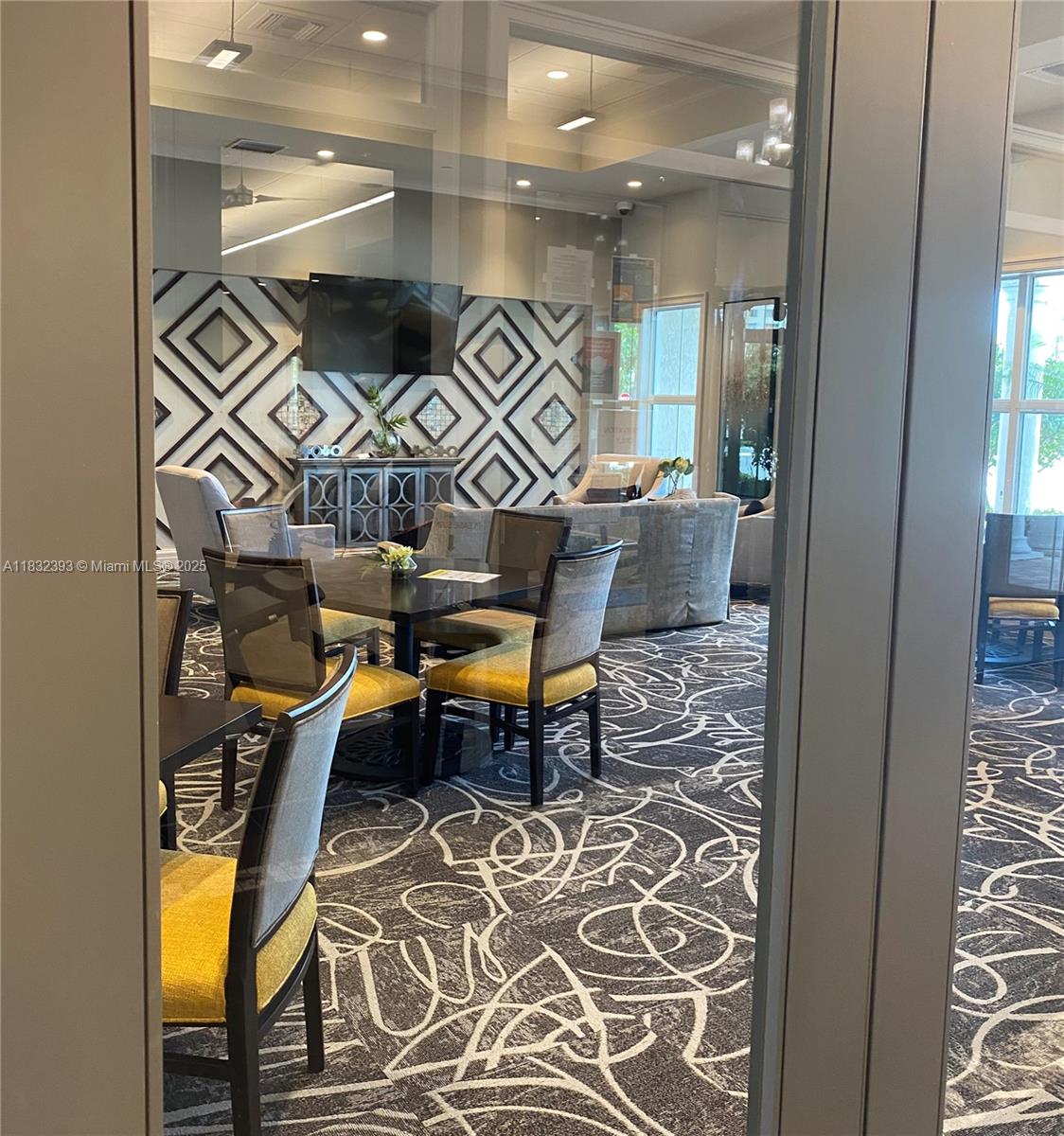 1280 Eucalyptus Drive, Unit 4 Hollywood, FL 33021 - Photo 27 of 36 a outdoor space with lots of white furniture