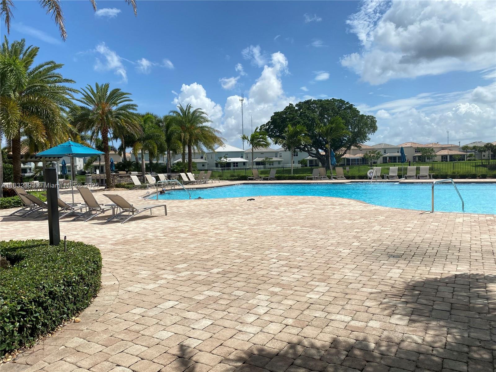 1280 Eucalyptus Drive, Unit 4 Hollywood, FL 33021 - Photo 29 of 36 a view of a swimming pool and an outdoor space