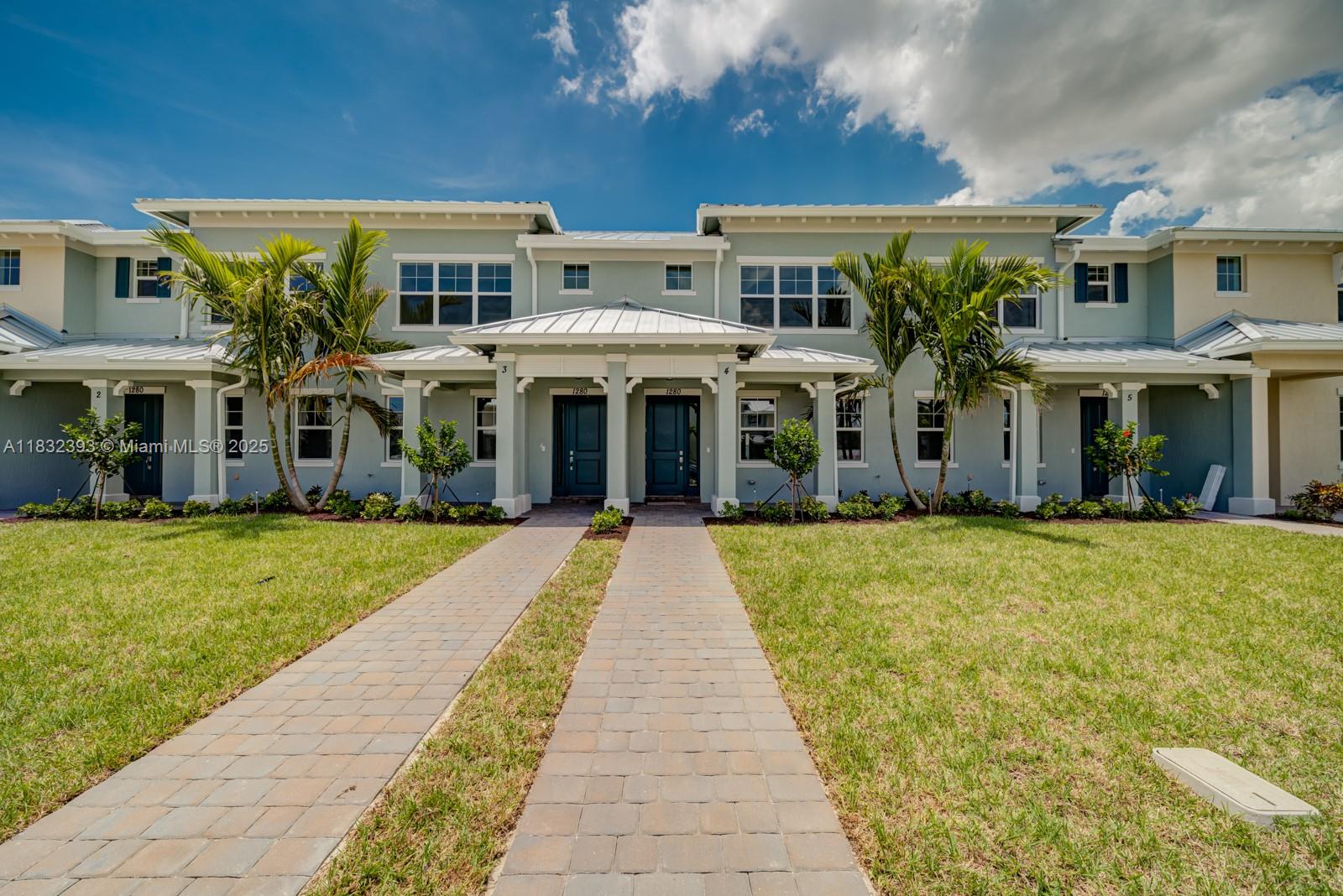 1280 Eucalyptus Drive, Unit 4 Hollywood, FL 33021 - Photo 6 of 36 a front view of a building with a garden