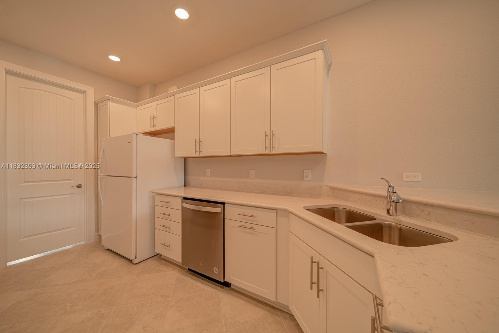 1280 Eucalyptus Drive, Unit 4 Hollywood, FL 33021 - Photo 7 of 36 a kitchen that has a sink and cabinets