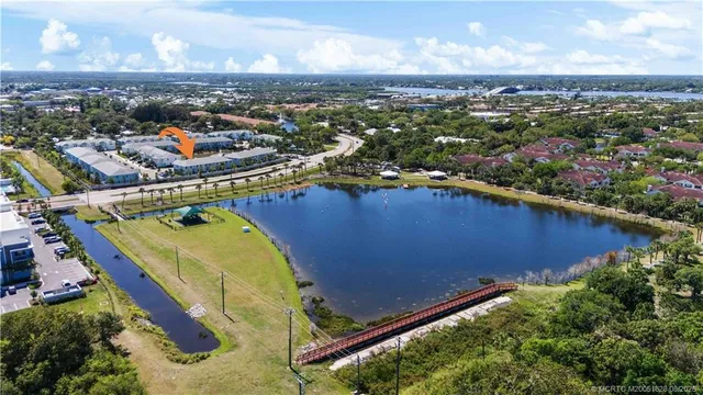 an aerial view of a house with a yard