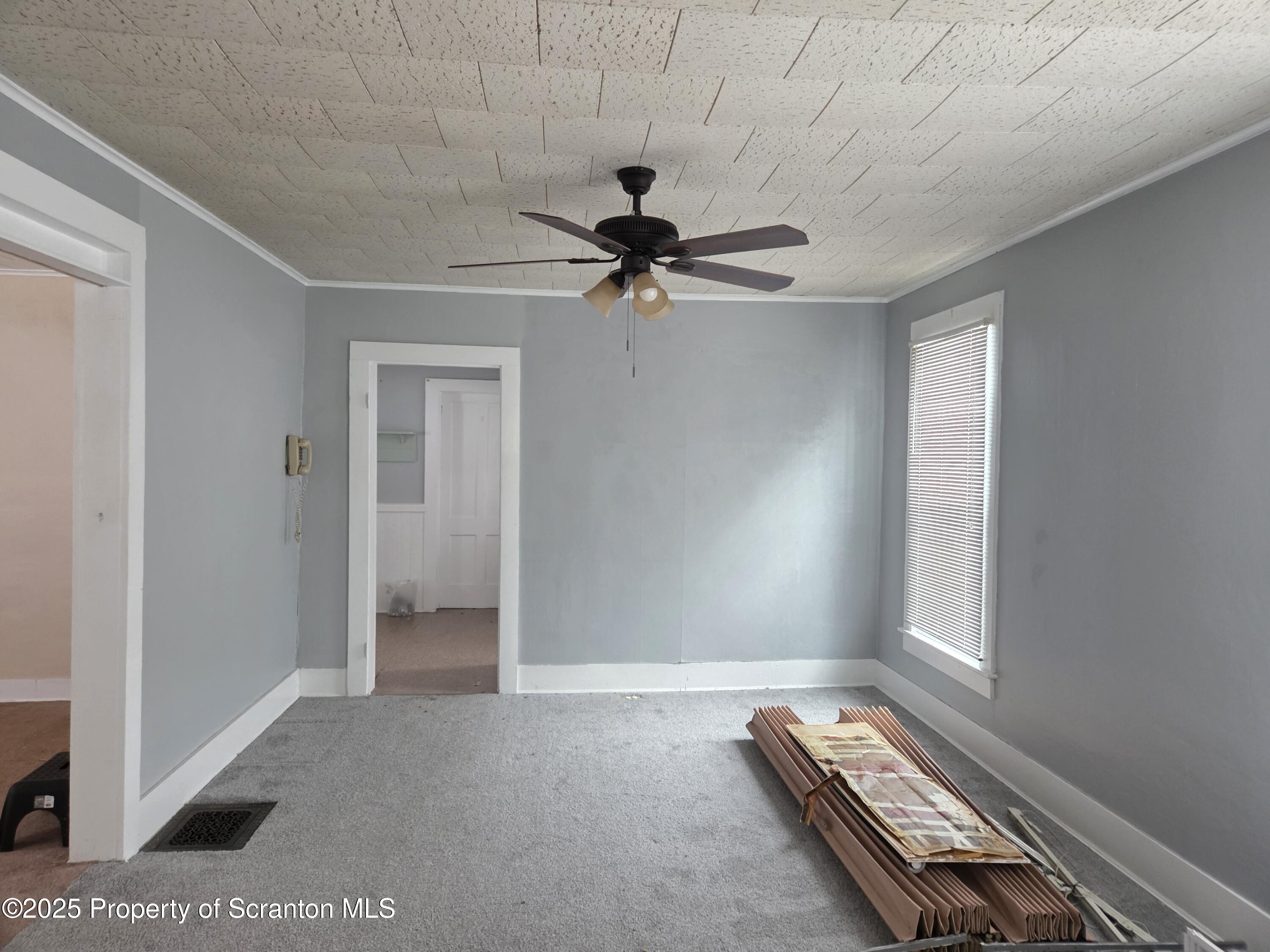 5 East Harrison Street Tunkhannock, PA 18657 - Photo 24 of 25 a view of room with a ceiling fan