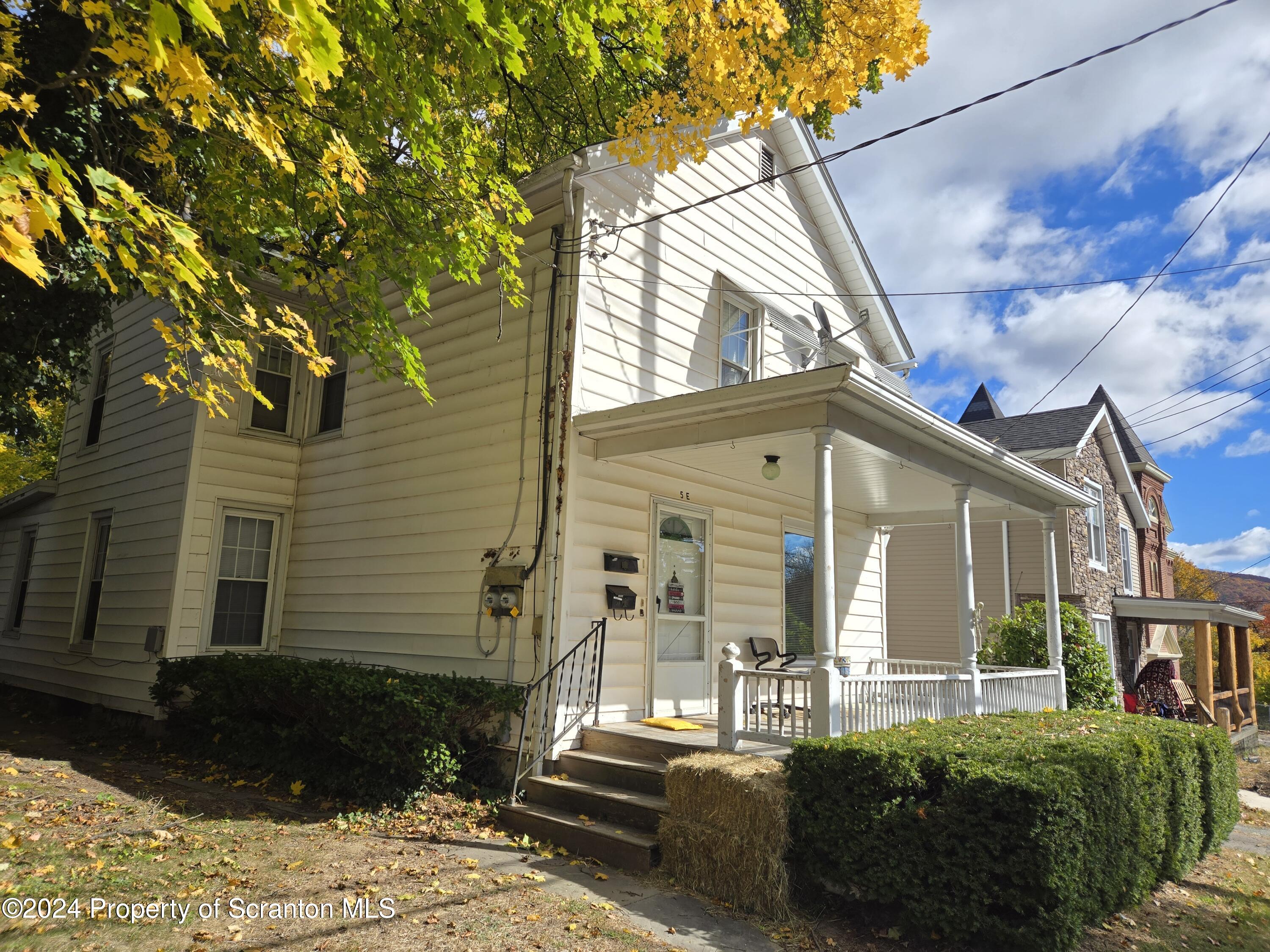 5 East Harrison Street Tunkhannock, PA 18657 - Photo 5 of 25 a front view of a house with a yard