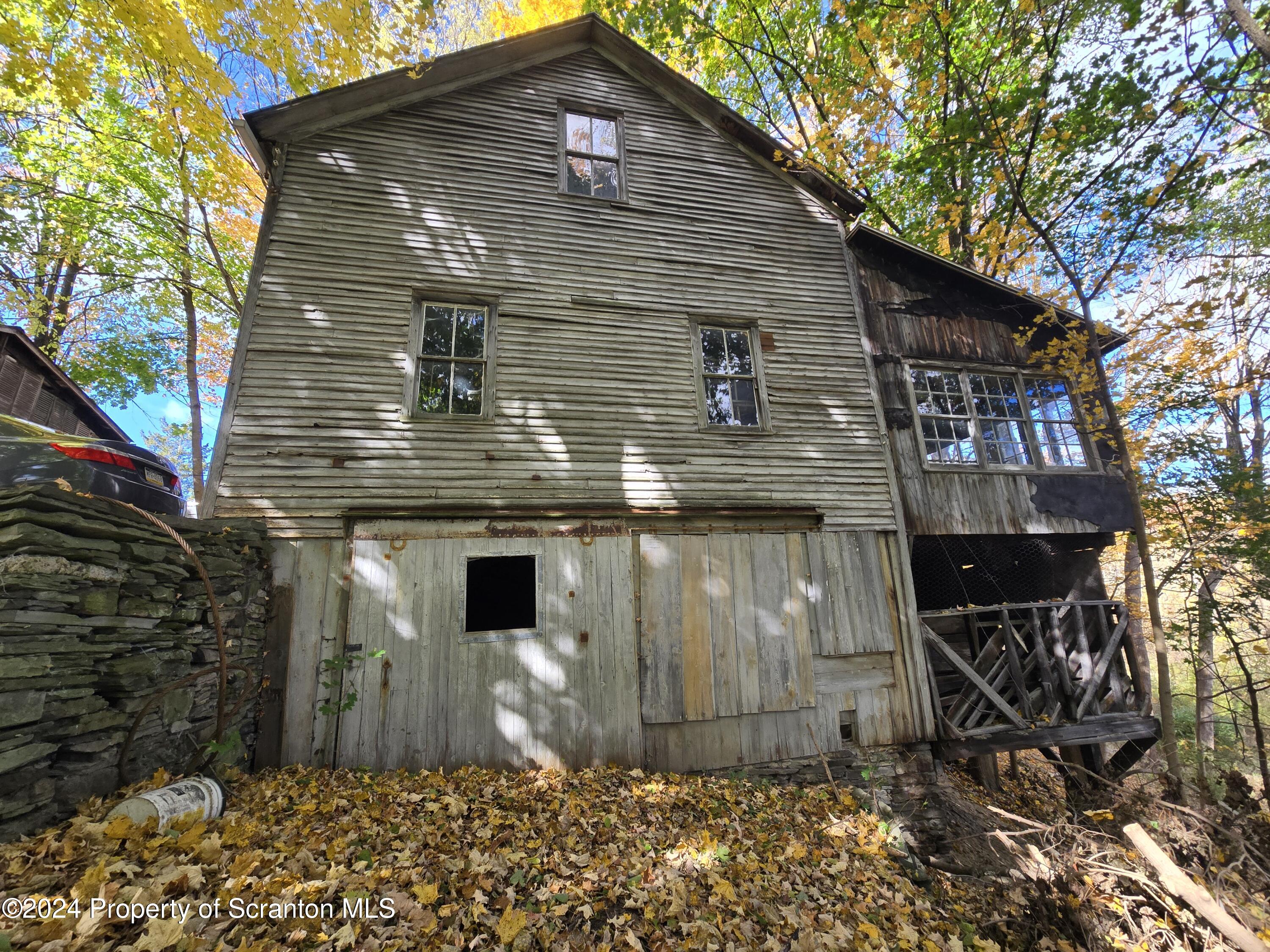 5 East Harrison Street Tunkhannock, PA 18657 - Photo 8 of 25 a front view of a house with garden