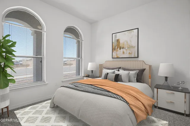 a bedroom with bed and a window