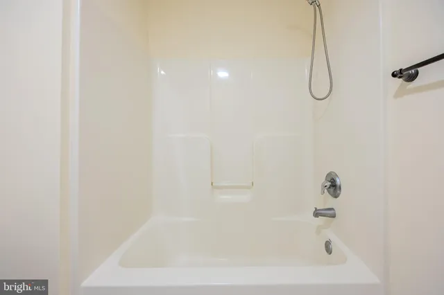 a close up of a bathtub in a bathroom