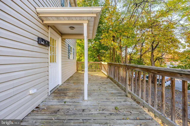 a view of a balcony with wooden floor