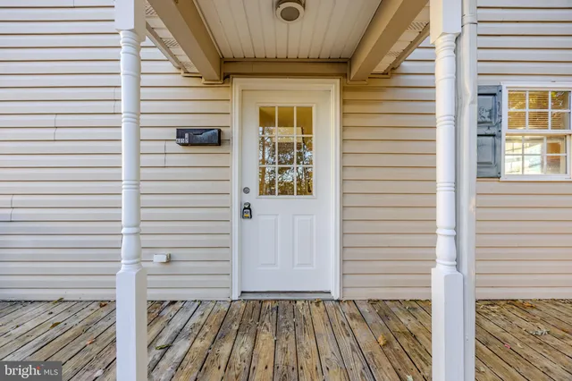 a view of a porch with wooden floor
