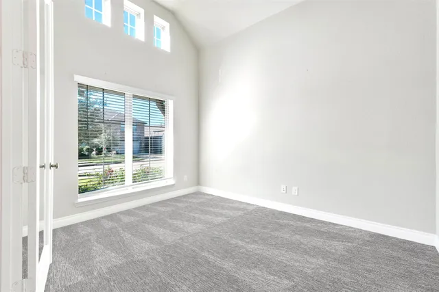 a view of an empty room with a window