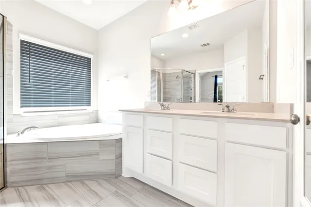 a bathroom with a sink and a bathtub