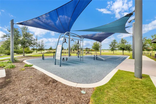 a view of a swimming pool with seating area