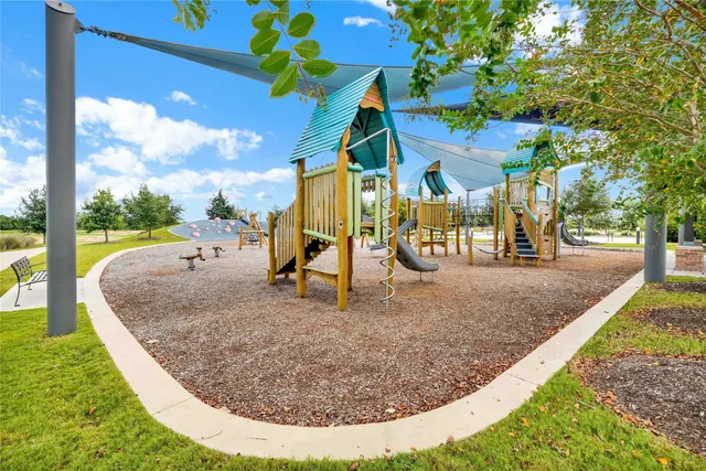 swimming pool view with a garden