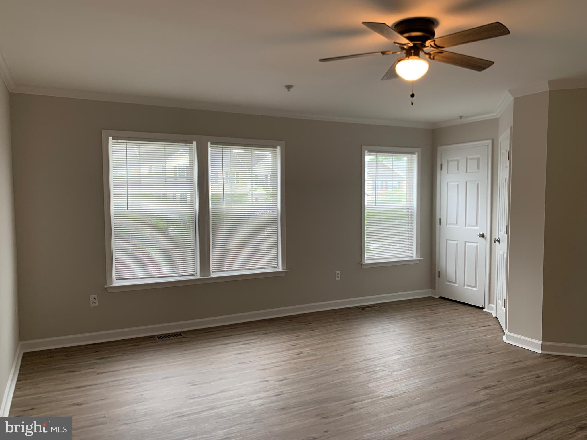 114 Sentry Ridge Smithsburg, MD 21783 - Photo 18 of 60 a view of an empty room with wooden floor and a window