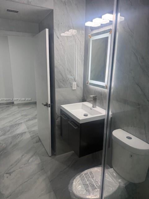 166 Northeast 70th Street, Unit 2 Miami, FL 33138 - Photo 12 of 15 a bathroom with a sink toilet and shower