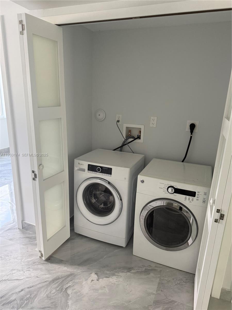 166 Northeast 70th Street, Unit 2 Miami, FL 33138 - Photo 14 of 15 a utility room with dryer and washer