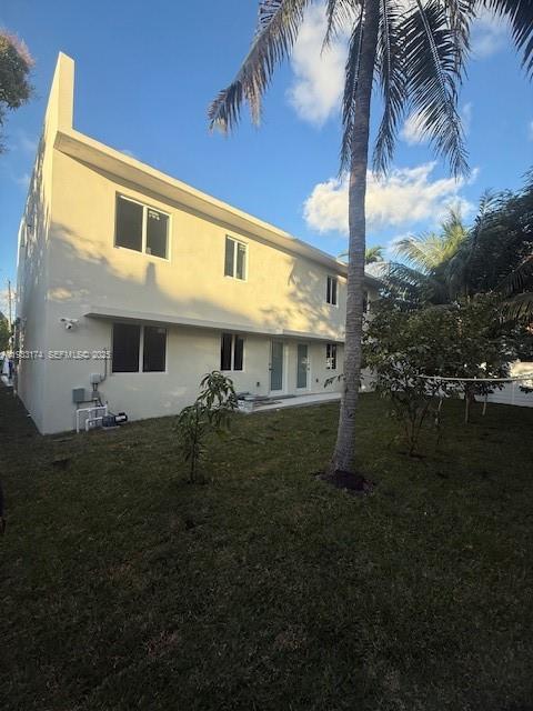 166 Northeast 70th Street, Unit 2 Miami, FL 33138 - Photo 15 of 15 a view of a house with a yard