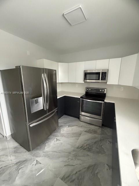 166 Northeast 70th Street, Unit 2 Miami, FL 33138 - Photo 7 of 15 a kitchen with granite countertop a refrigerator and a sink