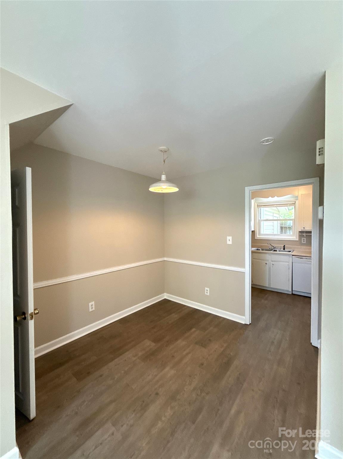 1613 North Sharon Amity Road, Unit G Charlotte, NC 28205 - Photo 4 of 12 a view of a room with wooden floor and window