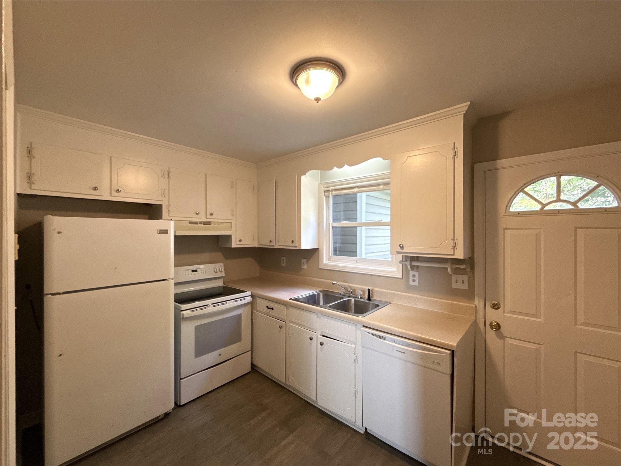 1613 North Sharon Amity Road, Unit G Charlotte, NC 28205 - Photo 5 of 12 a white refrigerator freezer and a stove top oven