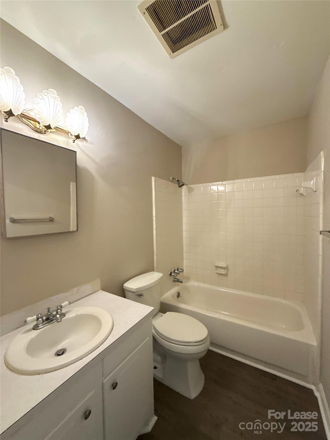 1613 North Sharon Amity Road, Unit G Charlotte, NC 28205 - Photo 9 of 12 a bathroom with a sink toilet and shower