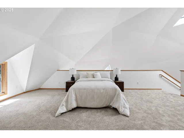 a bedroom with a bed and a night stand