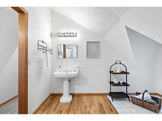 a bathroom with a sink a toilet and mirror