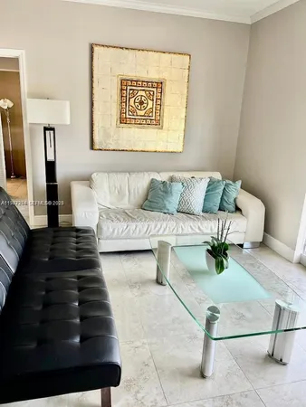 a living room with furniture and a rug