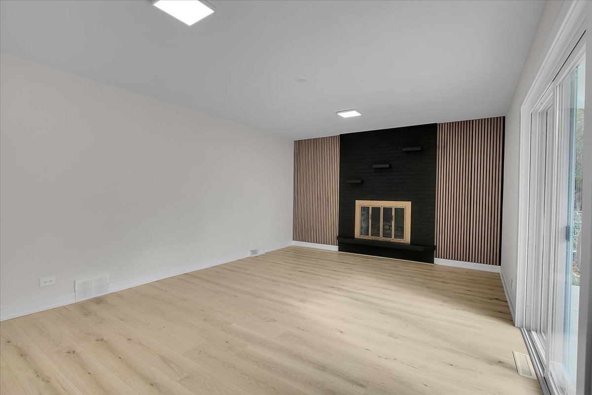 1109 71st Street Darien, IL 60561 - Photo 20 of 41 a view of an empty room with a window