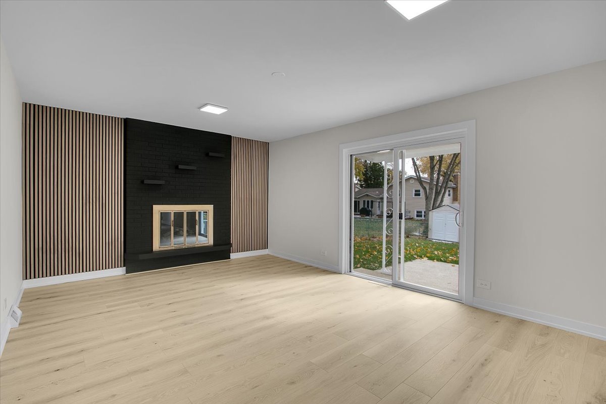 1109 71st Street Darien, IL 60561 - Photo 21 of 41 a view of an empty room with a window