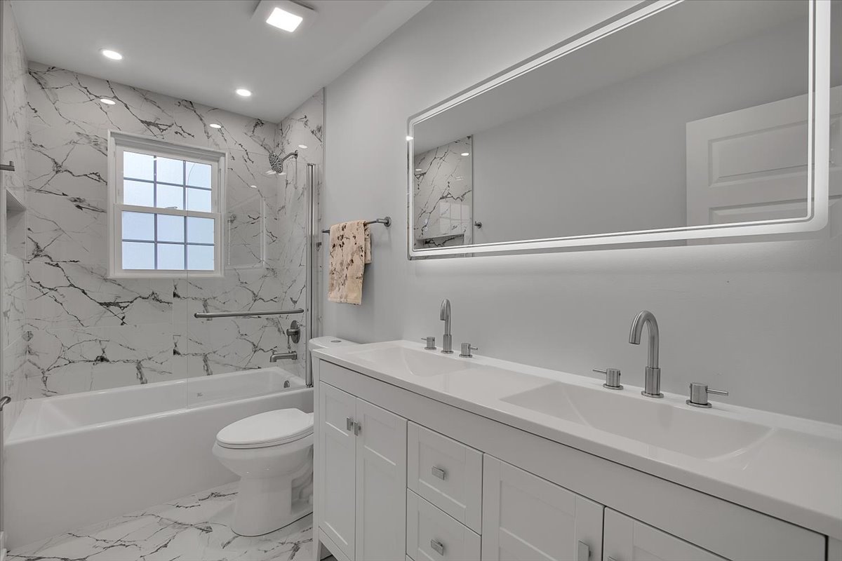 1109 71st Street Darien, IL 60561 - Photo 28 of 41 a bathroom with a sink a toilet and bathtub