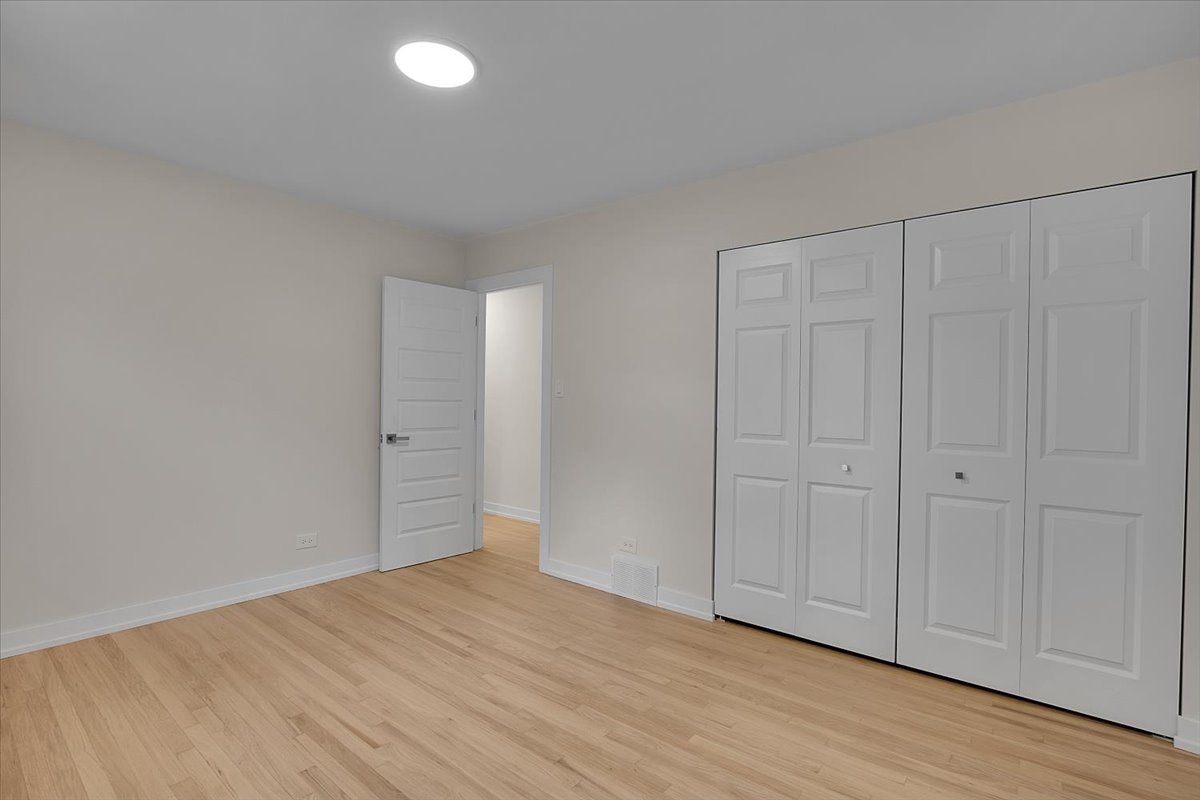1109 71st Street Darien, IL 60561 - Photo 30 of 41 a view of an empty room and wooden floor