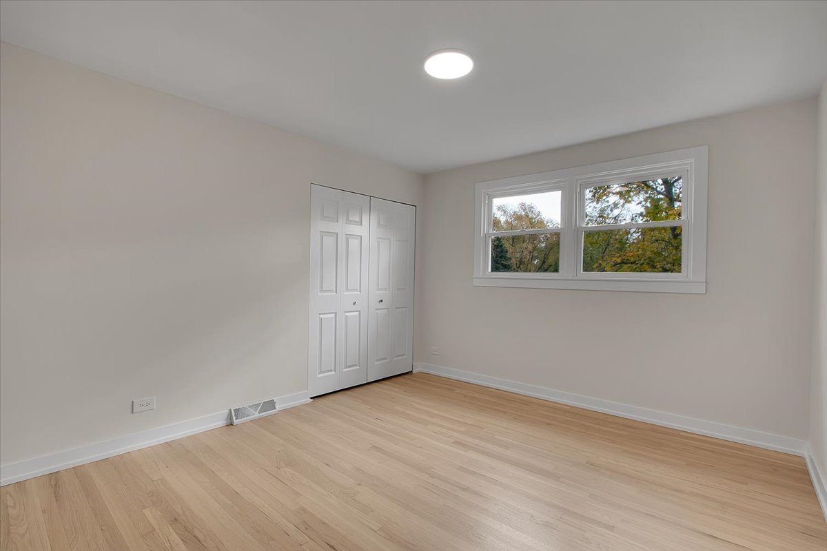1109 71st Street Darien, IL 60561 - Photo 32 of 41 wooden floor in an empty room with a window