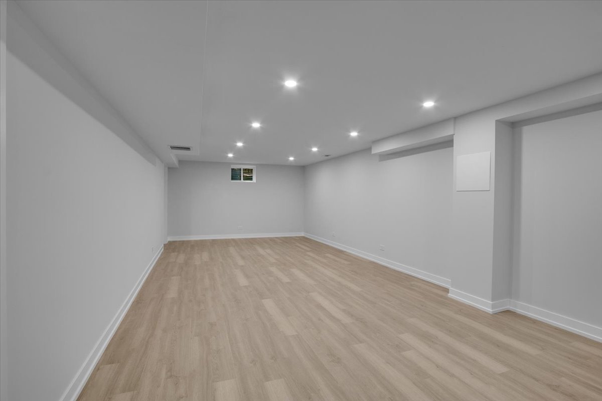 1109 71st Street Darien, IL 60561 - Photo 34 of 41 a view of empty room with wooden floor