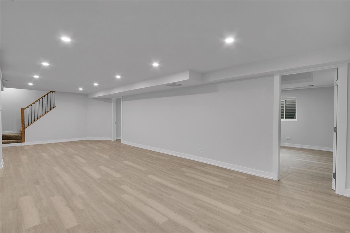 1109 71st Street Darien, IL 60561 - Photo 35 of 41 an empty room with wooden floor and windows