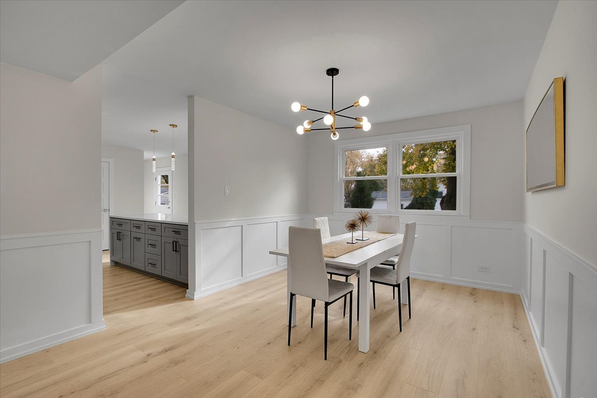 1109 71st Street Darien, IL 60561 - Photo 9 of 41 a view of a dining room with furniture and wooden floor