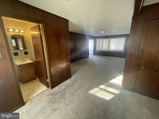 a view of a hallway with windows