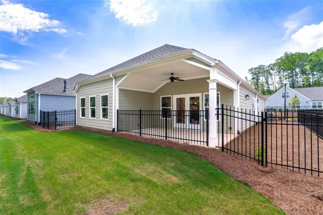 a view of a house with a yard and deck