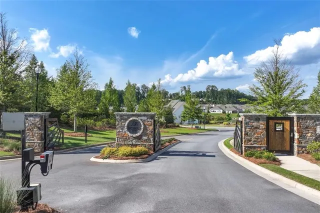 a view of a park with iron fence