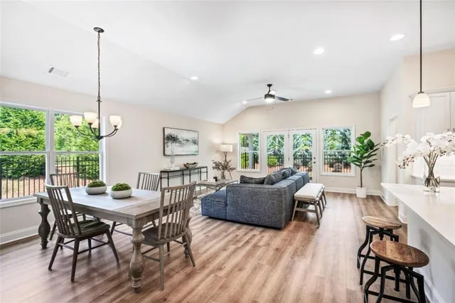 a view of a dining room with furniture window and outside view