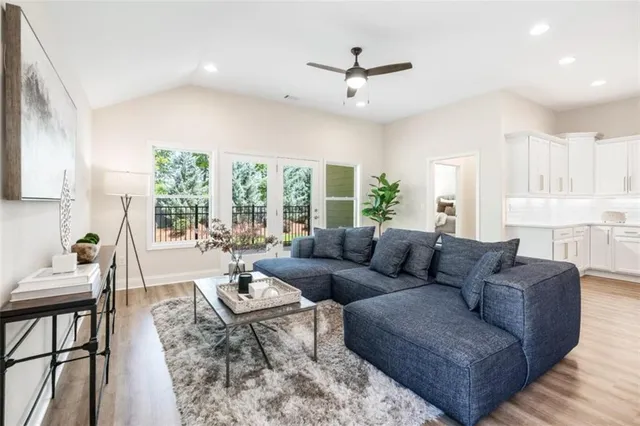 a living room with furniture and a large window
