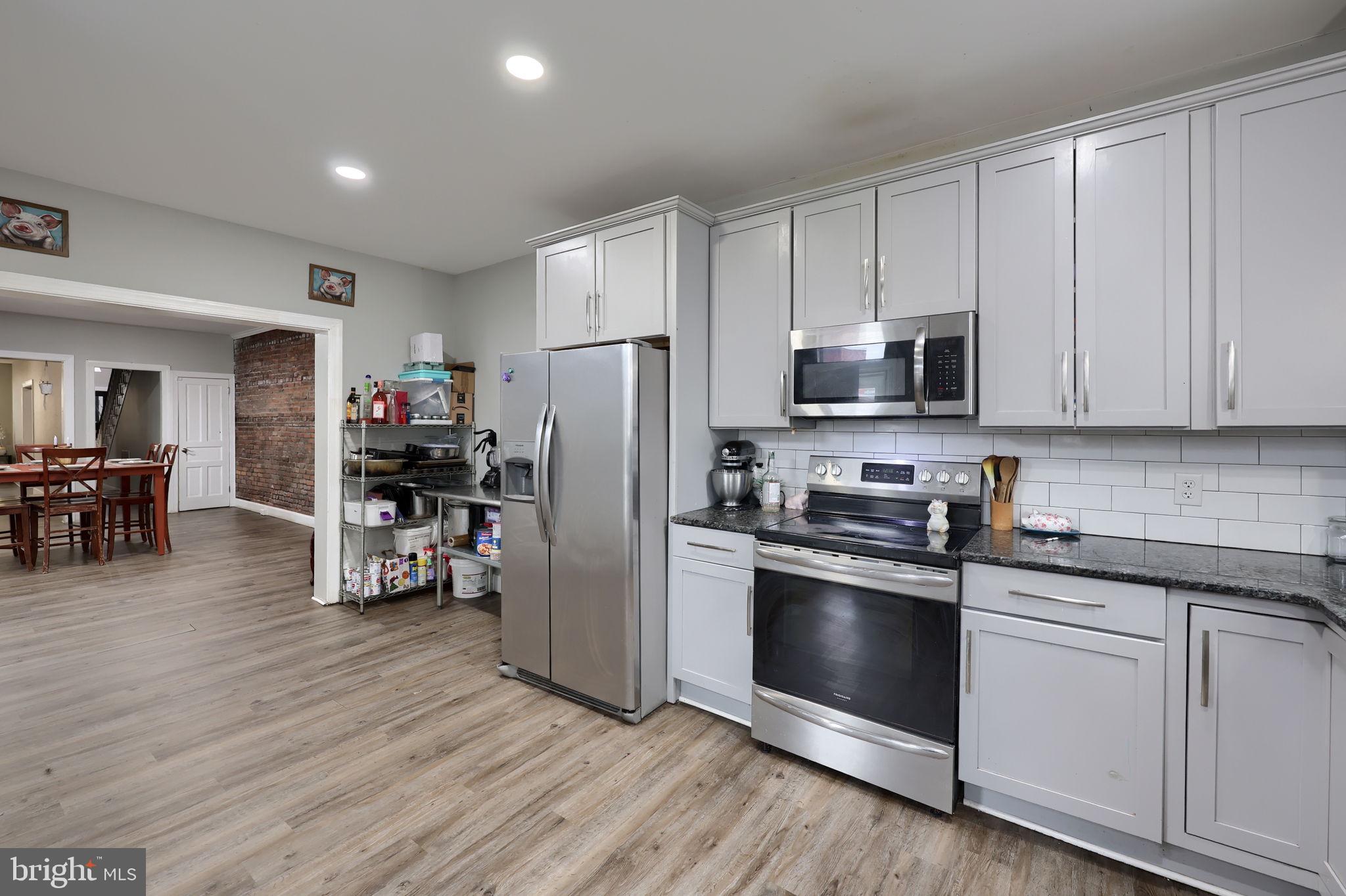 332 Perry Street Columbia, PA 17512 - Photo 14 of 37 a kitchen with stainless steel appliances a refrigerator stove and sink